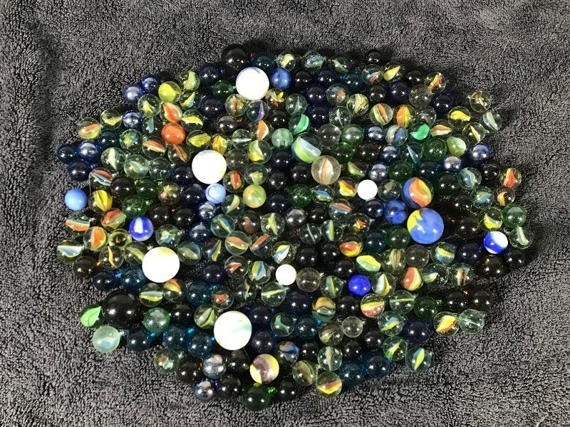 Lot of Collectible Marbles - some of them glow green when hit with a black light