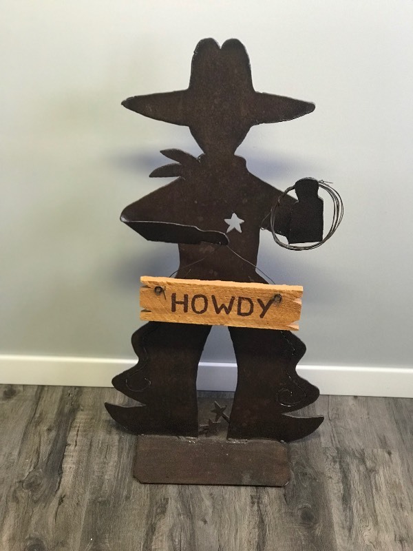 Cut Metal Iron Cowboy Statue Figurine that has a Wood sign that says Howdy