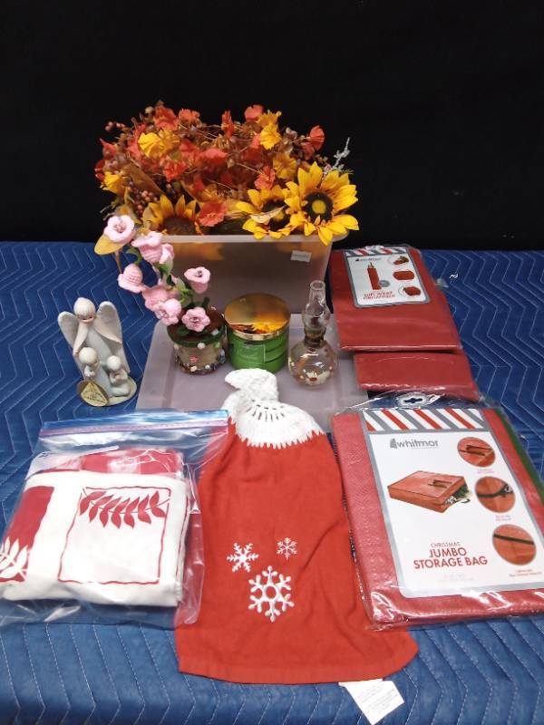 Christpher collection figurine, flowers, candle, storage bag, gift wrap organizer, tablecloths, oil lamp, and towel
