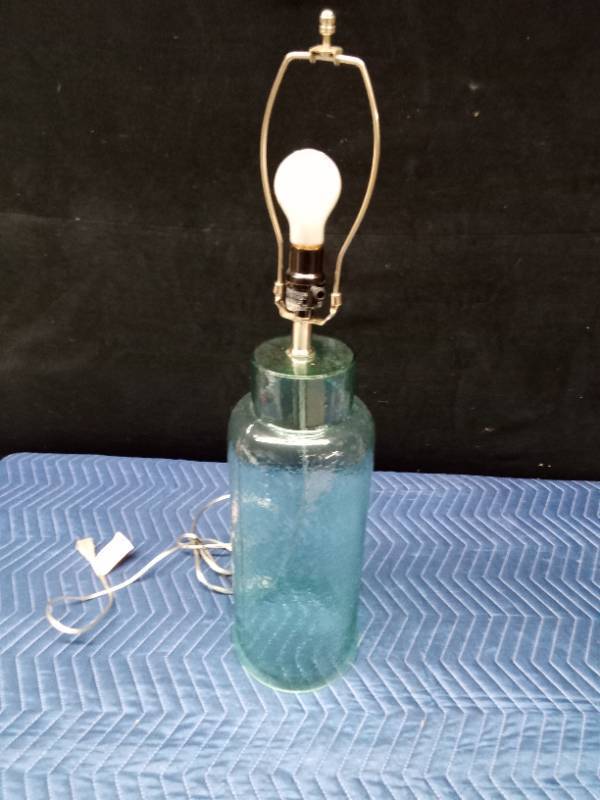 Lt. Green glass lamp with hollow bottom