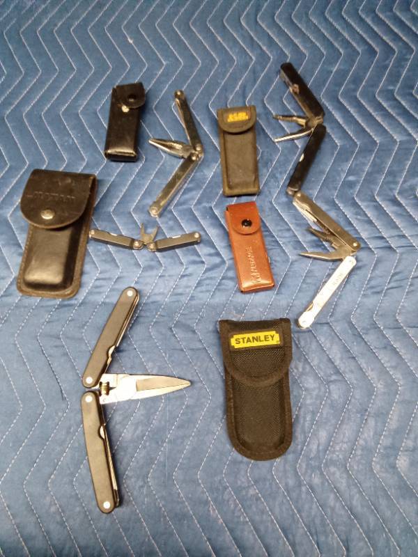 5 Leatherman tools and 5 cases