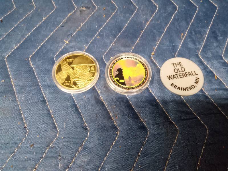 Army coin, Firemans coin and a drink chip from The Old Waterfall Brainerd, MN