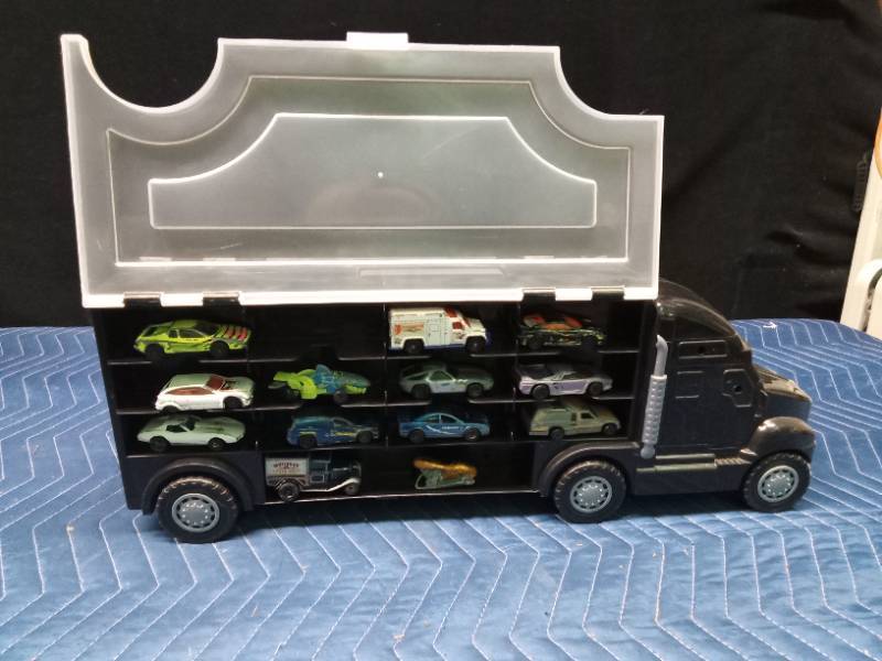 Semi toy car carrier with Hot Wheels and Matchbox cars