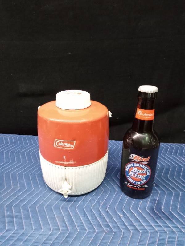 Coleman water cooler and a large Budweiser collector bottle