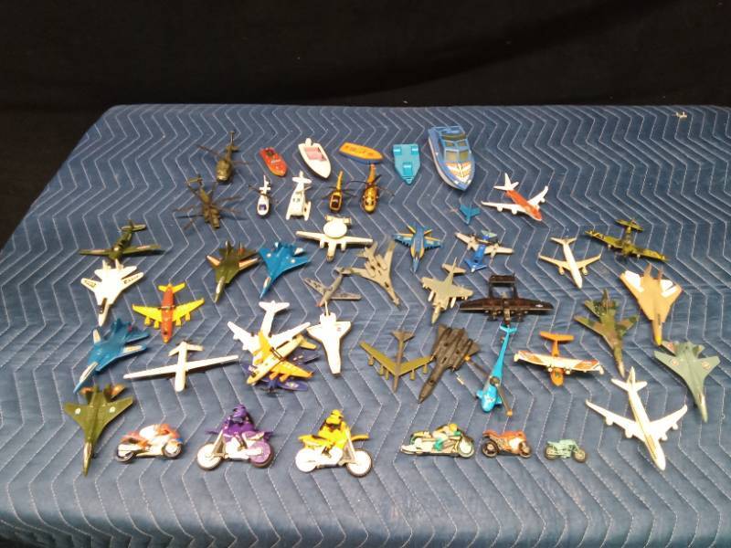 Toy boats, motorcycles, planes, helicopters