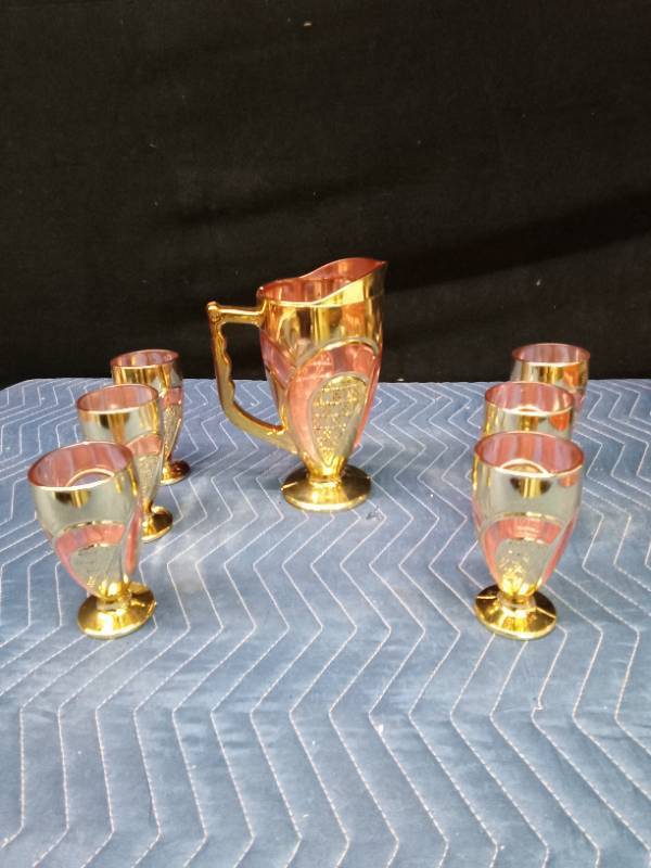 Gold and rose colored pitcher and 6 glasses