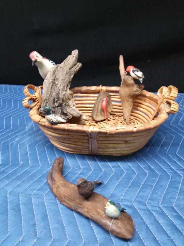 Basket of ceramic and wood birds (some on drift wood)