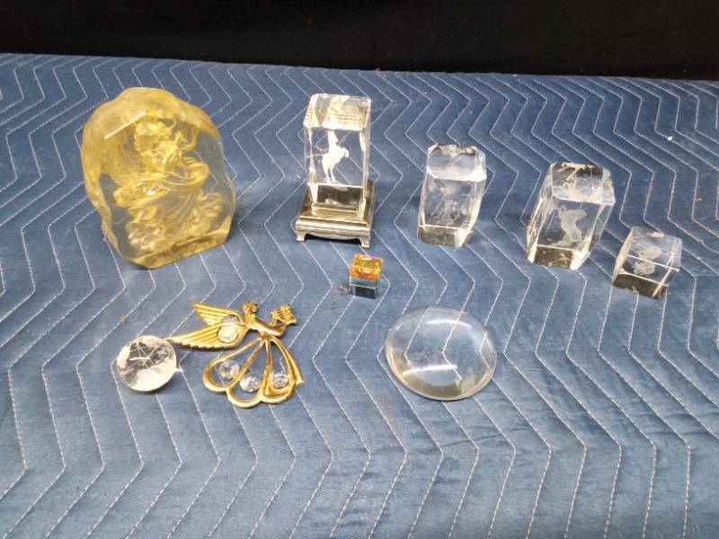 Crystal glass paperweights with different things etched inside and other crystals and more