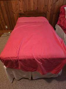 Pair of Twin Beds with Linens and Bed Skirts