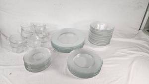 Clear Glass Dinnerware Including Plates, Bowls, and Cups