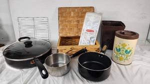 Assorted Kitchenware Items Including Mirro and Revere Ware Pots, T-fal Pan, Rubbermaid Ice Cube Tray, and Decorative Canister