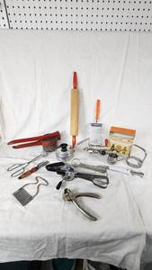 Vintage Kitchen Utensil Collection including Potato Ricer, Rolling Pin, and Hand Mixer