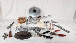 Lot of Vintage Kitchen Tools and Gadgets including Bun Size Wooden Hamburger Press, Potato Masher, and Egg Beater