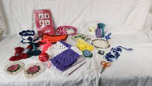 CrochetedKnitted Items and Yarn, Hooks, Patterns, and Scissors