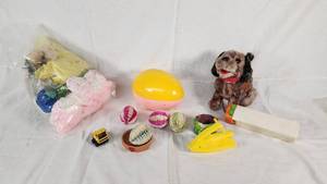 Plush Dog Toy (back legs broken), Yellow Stapler, Easter Egg, and Miscellaneous Items