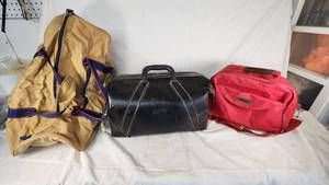 Tan Duffel Bag, Black Leather Bag, and Red Travel Bag