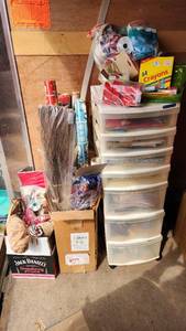 Craft Supplies and Holiday Decorations including Yarn, Wrapping Paper, and Quilting Magazines with rolling drawer plastic cabinet