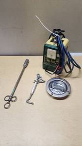 Hi-line Battery Charger, Turnbuckle, Livestock Pill Balling Gun, and Tie-down Ring