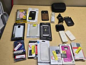 Various Phone Accessories Including OtterBox Defender Case, Mophie Juice Pack, and Samsung S-View Flip Covers