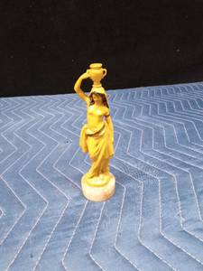 1920s or 1930s Celluloid lady carrying water on a marble base