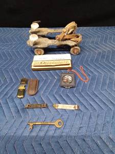 Vintage items including Marlboro lighter and Grain Belt bottle opener