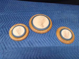 3 Blue Moon pottery bun warmers with indentations of plants