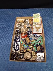 Flat of jewelry, earring holder, and candle
