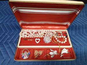 Jewel box of pins, necklaces and earrings