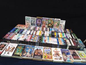 3 Suitcases full of 150 VHS tapes including 2 that have never been opened