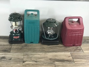 2 - Coleman Lanterns with Cases - 1 is gas and the other is propane