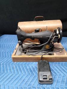 Antique Singer sewing machine in rounded top case