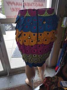 Colorful, Layered Patchwork Skirt Featuring Circular Patterns.