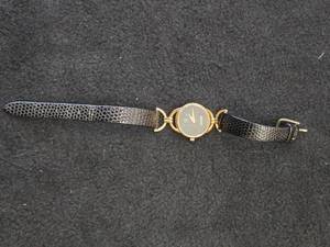 Gucci Ladies Wrist Watch with Gold Plated Case and Black Textured Leather Strap