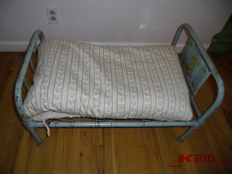 lot 43 image: Adorable Antique Metal Pipe Doll Bed - Feather Mattress & Doll Clothes