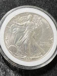 1987 AMERICAN SILVER EAGLE 1 TROY OZ .999 FINE SILVER IN AIRTITE