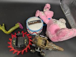 EnerGizer Round Container with Plush Bunny and Vehicle Parts - Mixed Toy Collection