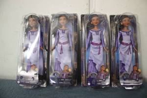 4 disney barbies Asha from the mov...