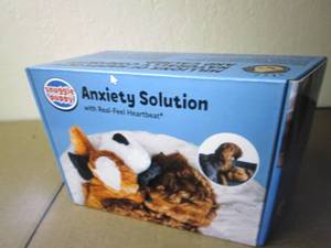 New plush dog toy, Snuggle Puppy, a...