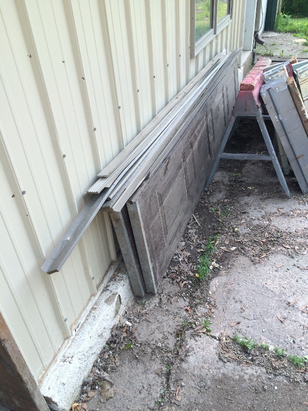 lot 281 image: large lot of Garage door hardware, set of rails and (2) 9 panels