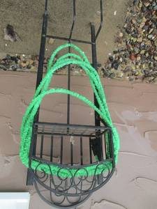 Hose on metal rack with sprayer