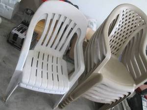 Beige Plastic Stacking Chairs with Armrests