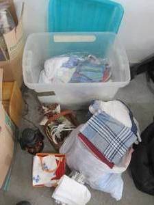 Clear Plastic Storage Tote with Assorted Linens, Towels & Decorative Home Decor