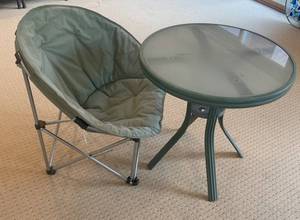 Green Folding Chair with Cushioned Seat & Round Glass Table