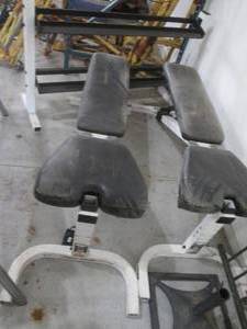 Pair of weight benches and a dumbbell rack
