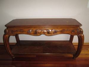 Ornate accent table, made of solid wood.  This quality piece of furniture will add class and style to any room