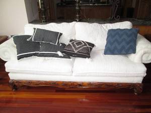 Classy white couch with accent pillows