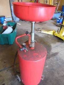 Automotive fluid waste oil drain tank canister with pressure regulator