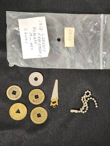 French 10 Centimes Coin and Asian-Inspired Coins with Miniature Saw and Chain