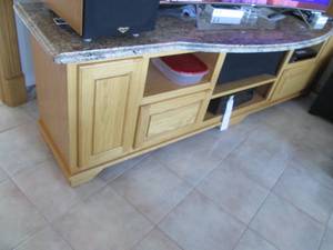 Wide solid wood entertainment stand with a granite top