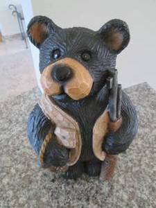 Bear bank and a wood turtle stand...